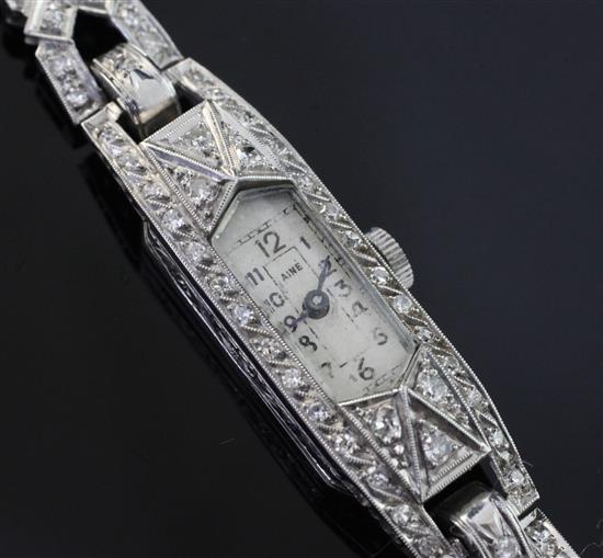 A ladys 1920s/1930s white gold and diamond set cocktail watch, 6.75in.